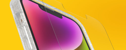 OtterBox glass screen protector being installed on iPhone on a yellow background