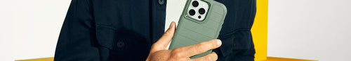 Man holding green OtterBox Defender Series iPhone case