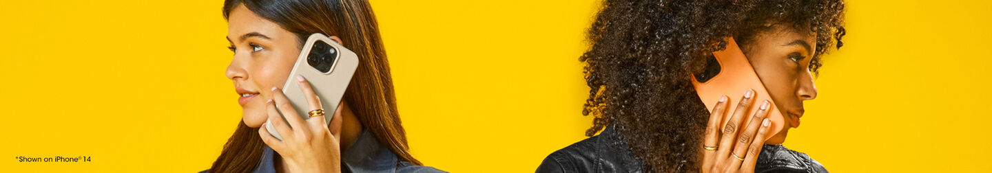 Two women using smartphones against a yellow background