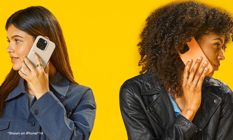 Two women using smartphones on a yellow background