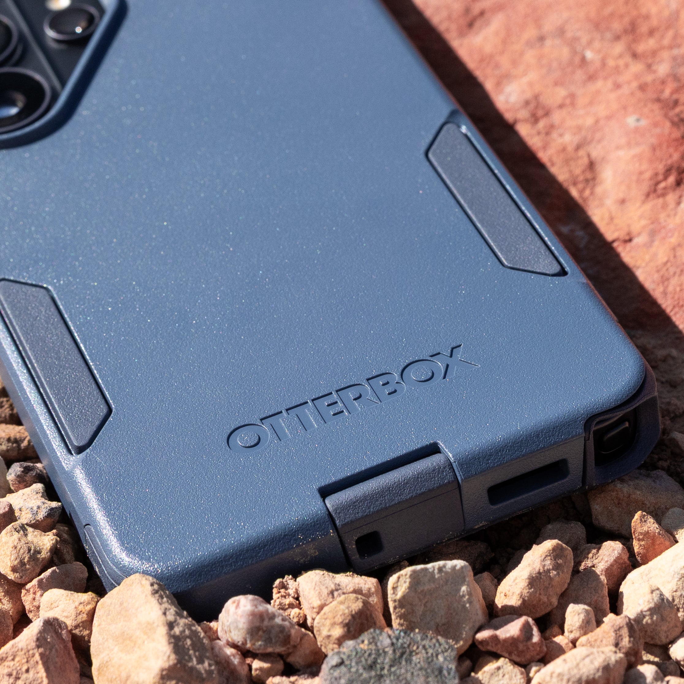 Close up of blue commuter case showcasing port covers