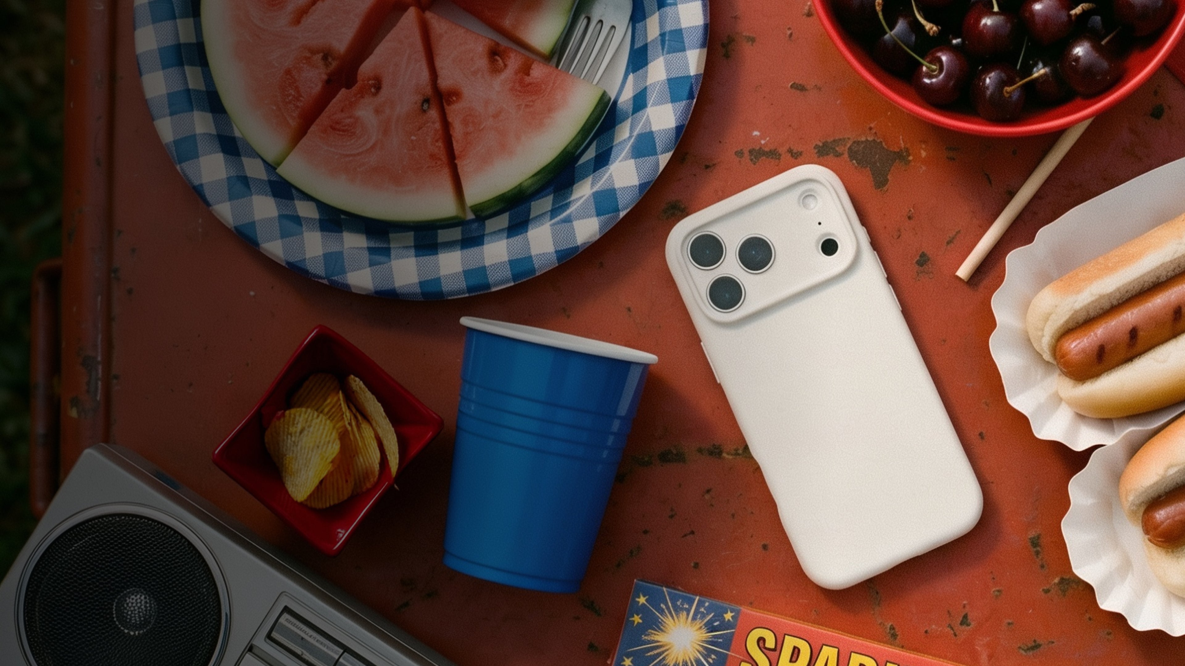 Phone case on a table with food and a radio
