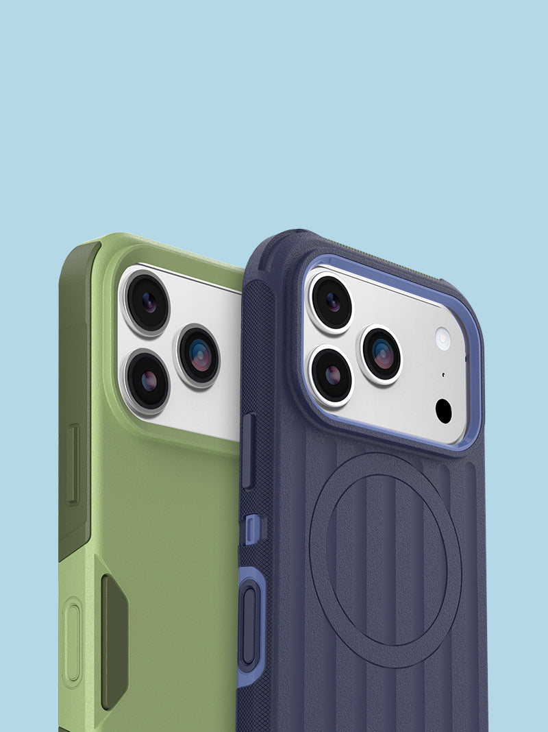 Two protective phone cases shown on a light blue background, one in sage green and one in dark navy blue. Both cases feature a rugged dual-layer design, raised camera cutouts, side button covers, and a circular magnetic ring on the back.