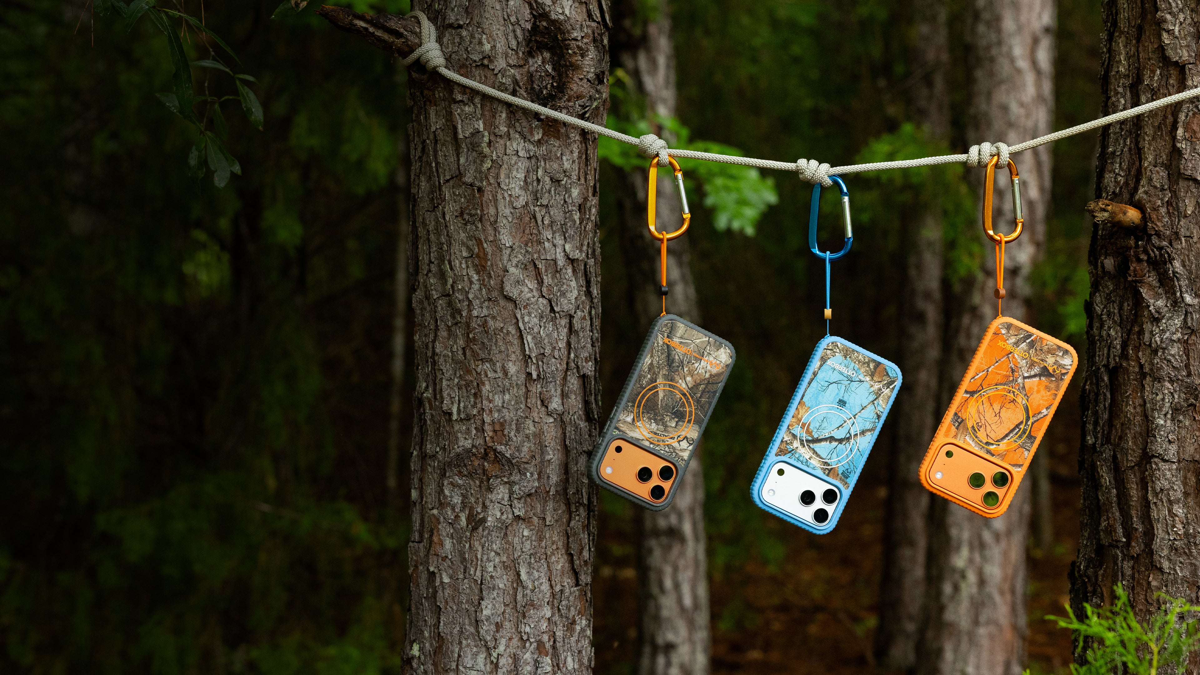 Sole realtree cases hanging from a tree in a woods scene