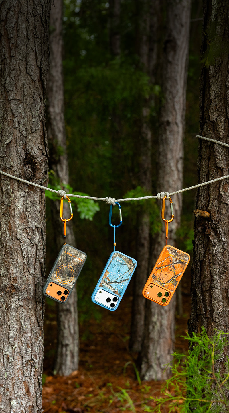 Sole realtree cases hanging from a tree in a woods scene