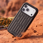Black OtterBox defender case hitting red rocks showcasing drop defense and rugged protection 