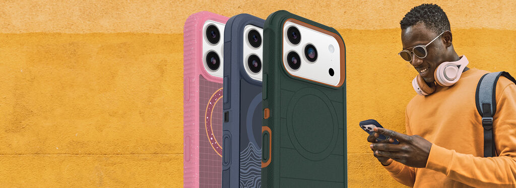 Three phone cases in pink, blue, and green with a person using a phone on an orange background.