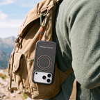 OtterBox Sole Series phone case attached to a hiking backpack with a removable finger loop, highlighting a secure carry option for outdoor adventures.