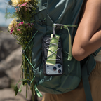 OtterBox Sole Series Pack phone case attached to a backpack with elastic cord storage, carrying small essentials during an outdoor adventure.