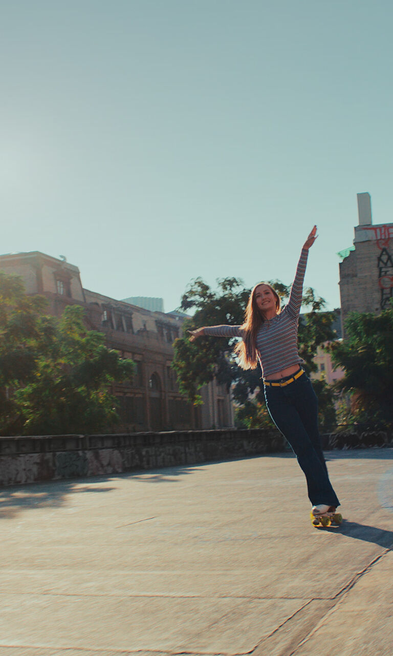woman holding a bright green iphone case | OtterBox