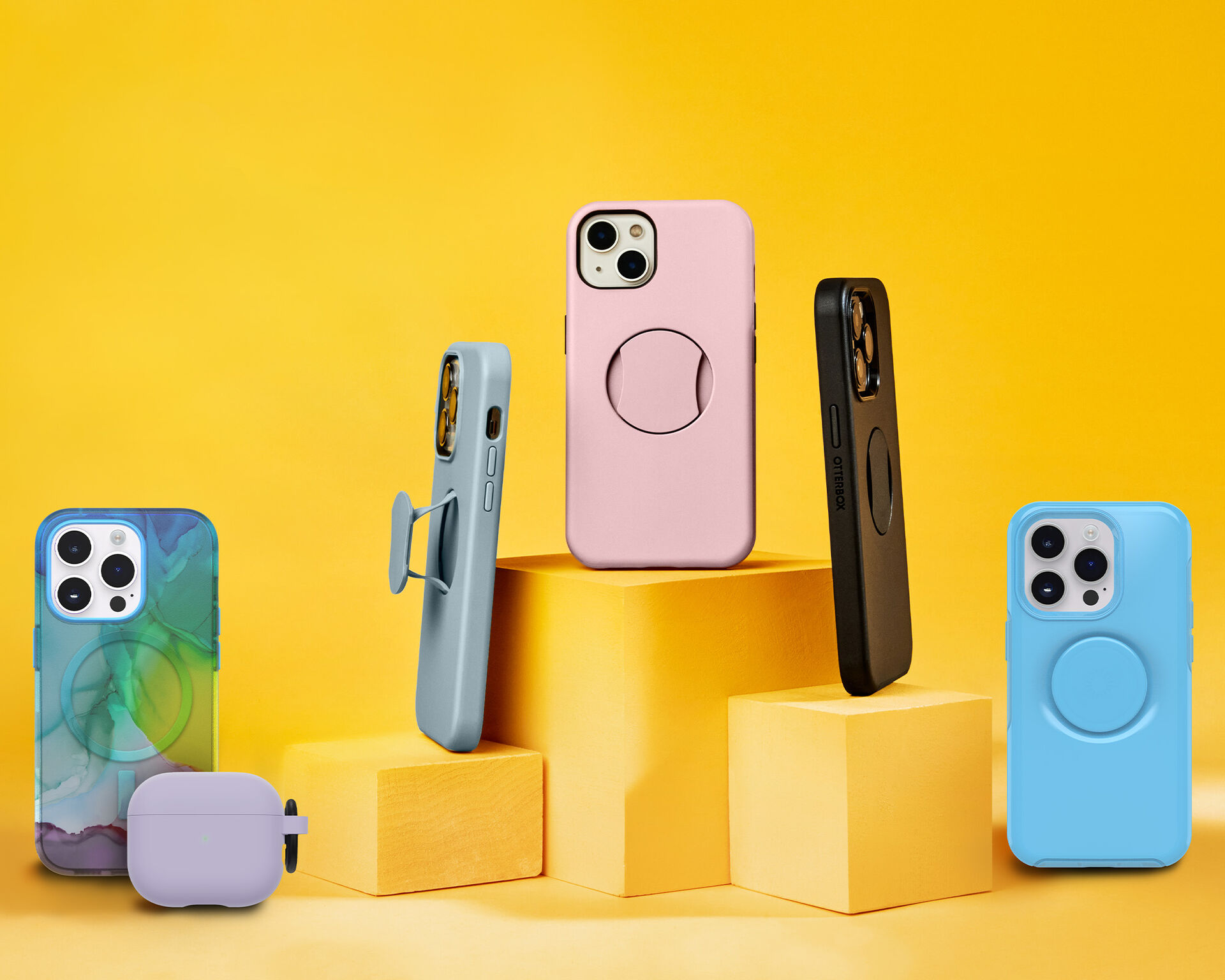 Yellow display with various case styles and colors with an airpods case.
