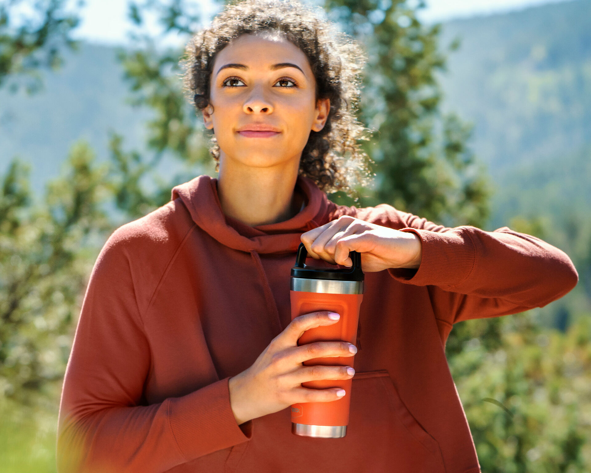 Woman holding a red tumbler 