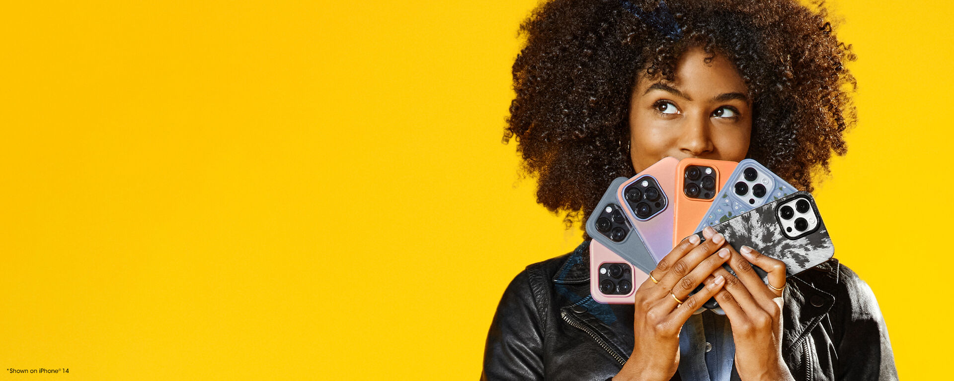 Woman fanning out colorful iPhone cases